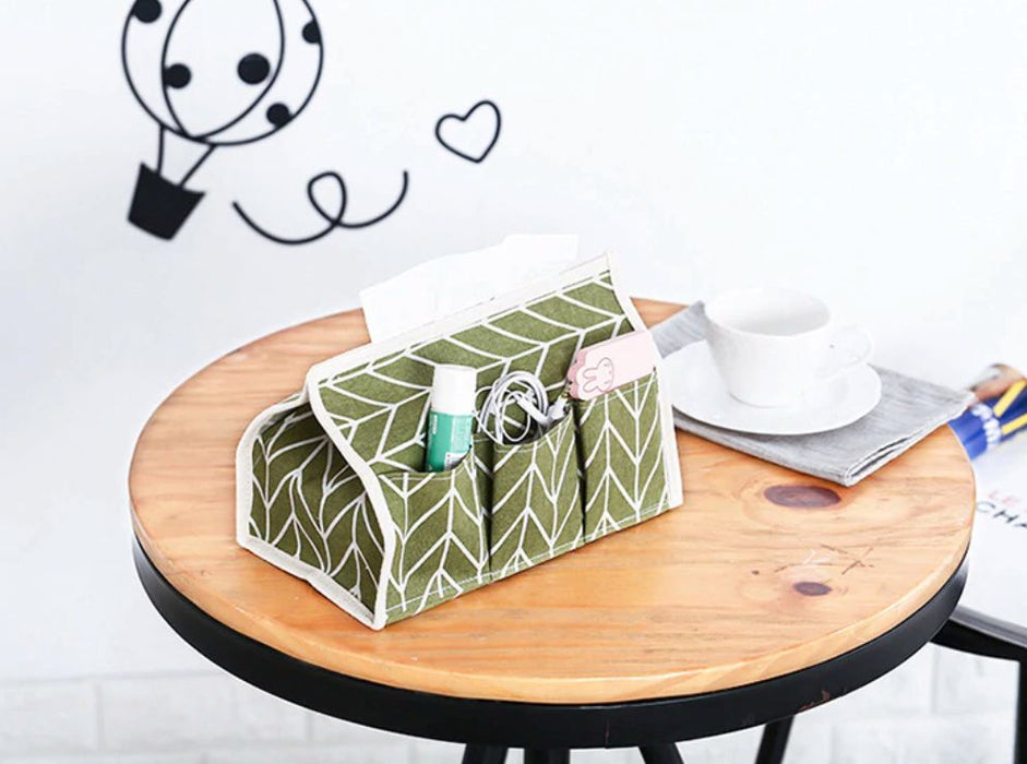 Tissue Box Organizer - Green-Description: This multi-purpose Tissue Box Organizer by Lemonade is made of natural cotton & linen. This stylish tissue box can be used in a restaurant, office, household & even a vehicle.It helps you declutter your storage space, organise your belongings & serves as a great decor item in any room!It's very portable and small & is made with a dust resistance material making it super easy to clean.Save your space when not in use, you can fold & keep it away. Sold Indi
