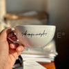 Close-up of personalized cappuccino mug lite with elegant handle and custom text design