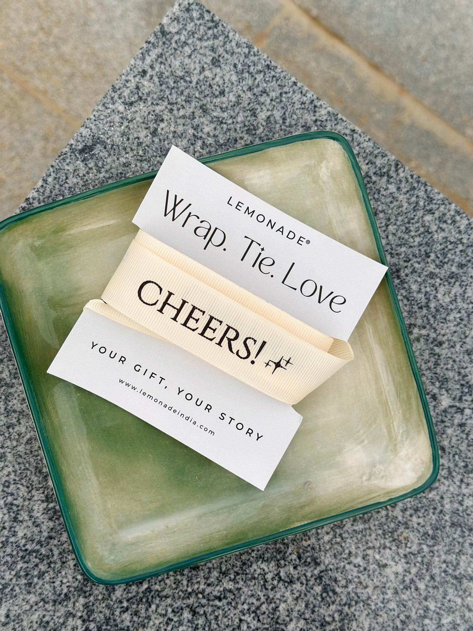 Pre-designed festive ribbon with printed designs for gift wrapping, party décor, and seasonal celebrations. Lemonade Stationery.