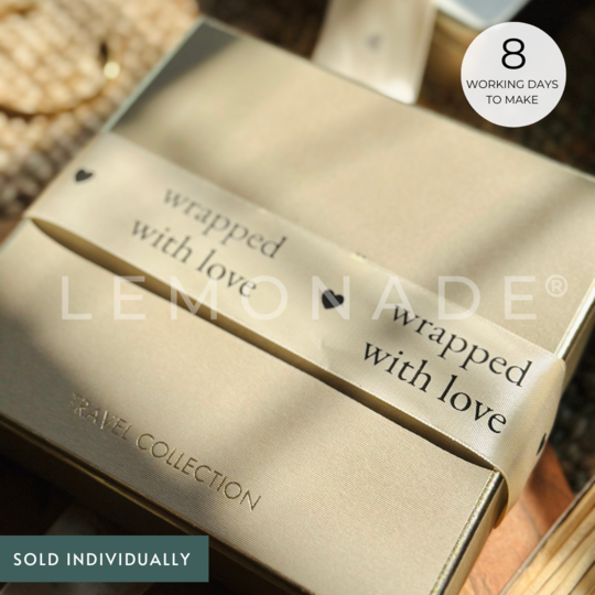 Personalized satin ribbon in cream color for custom gift wrapping and branding from Lemonade India.