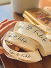 Personalized satin ribbon in cream color for custom gift wrapping and branding from Lemonade India.