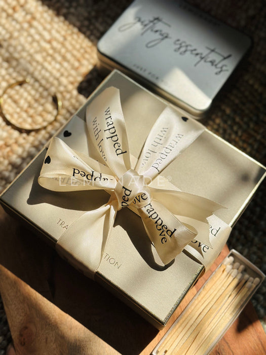 Personalized satin ribbon in cream color for custom gift wrapping and branding from Lemonade India.