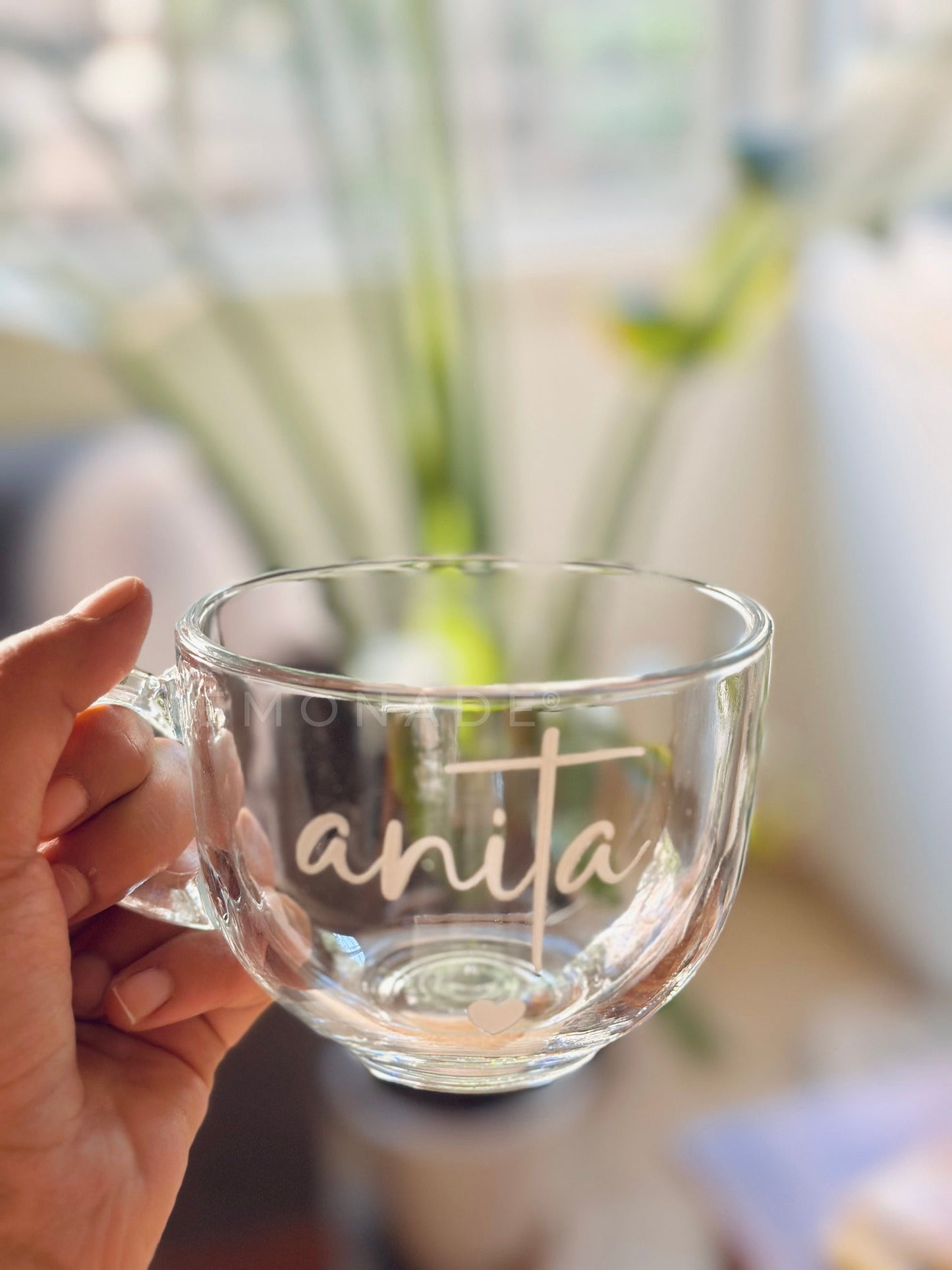 Clear soup bowl with handle featuring elegant cursive text