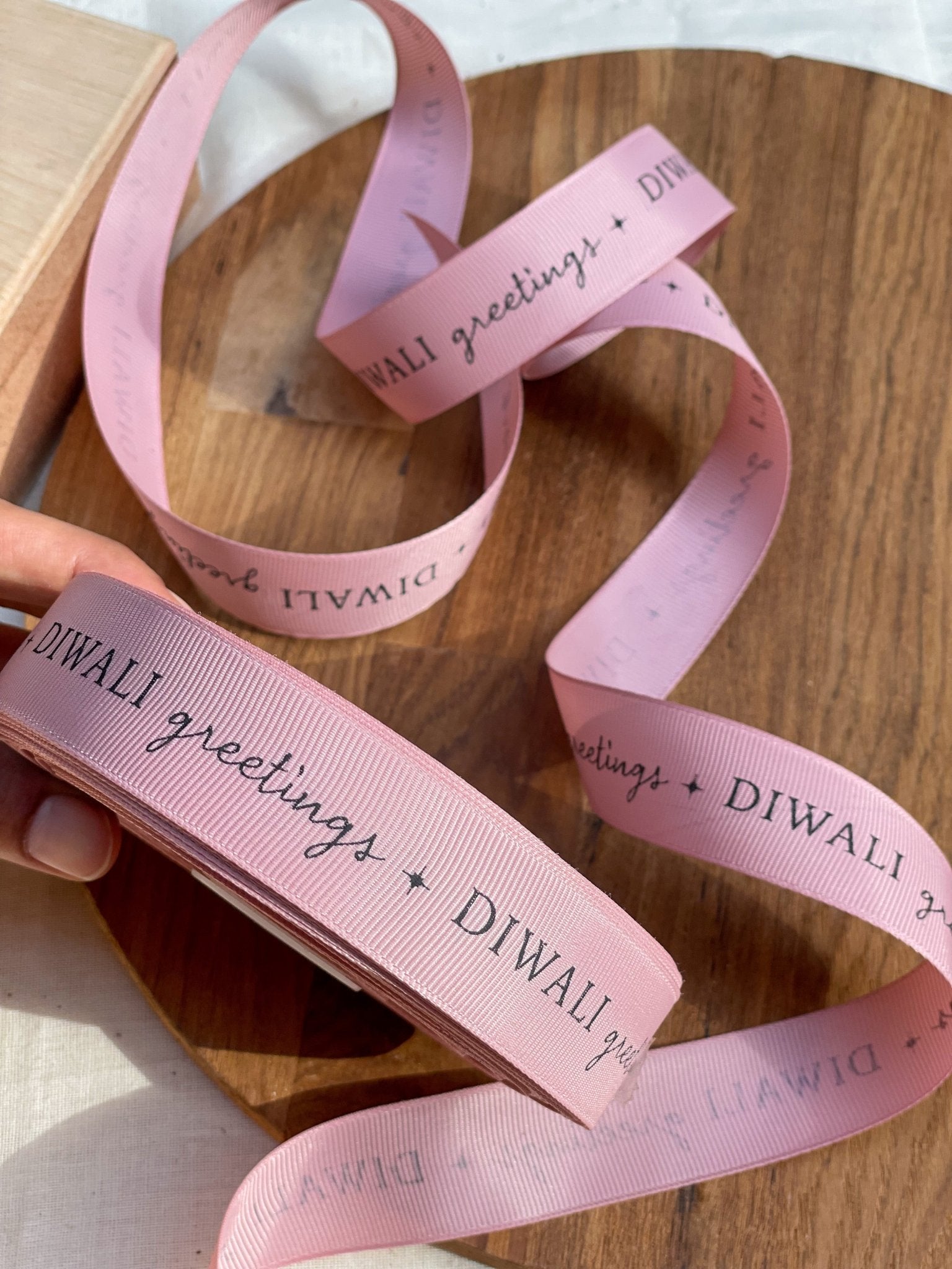 Pre-designed festive ribbon with printed designs for gift wrapping and decorations.
Diwali Greetings - Pink LemonadeStationery