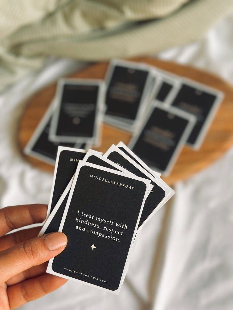 affirmation cards by Lemonade India on a bed