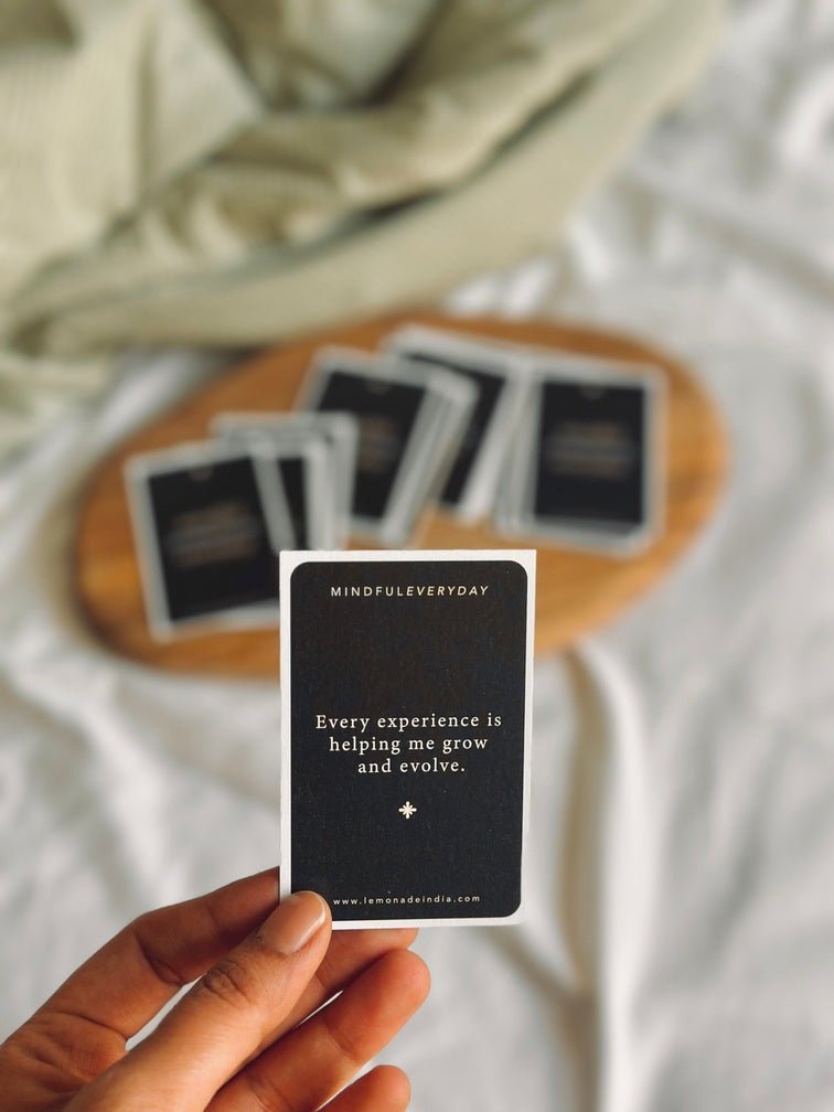 Hand holding personalised affirmation cards for daily mindfulness