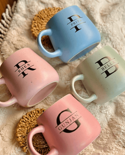 Set of 4 personalized initial mugs styled 