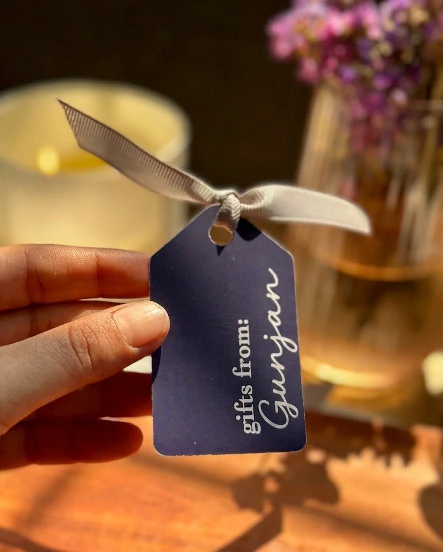 Luxury blue gift tags with personalized "Gifts from" cursive text