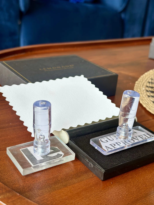 Clear acrylic stamp with engraved logo for packaging and stationery
