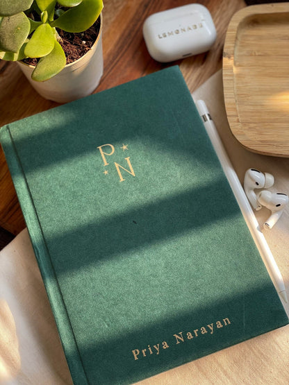 Personalized hardbound notebook with custom initials for a unique touch.
