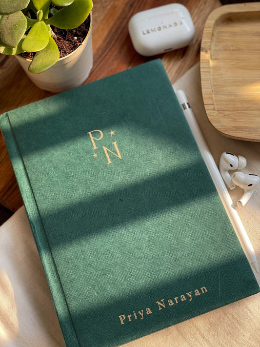 Personalized hardbound notebook with custom initials for a unique touch.