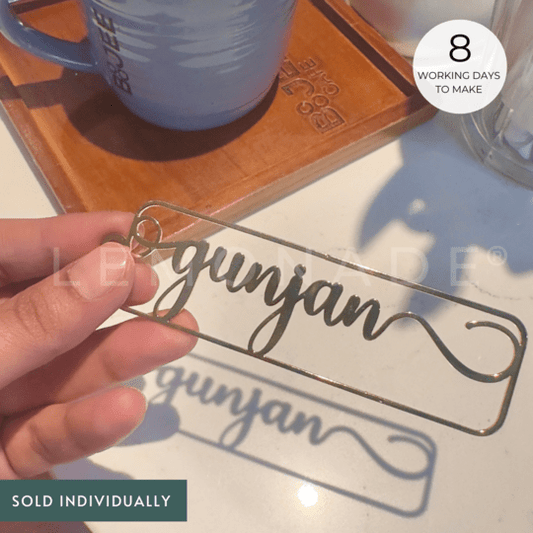 Free flow book mark in gold with cursive font 