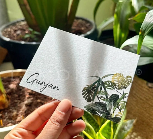 Luxury personalized notecards featuring tropical monstera leaf illustrations