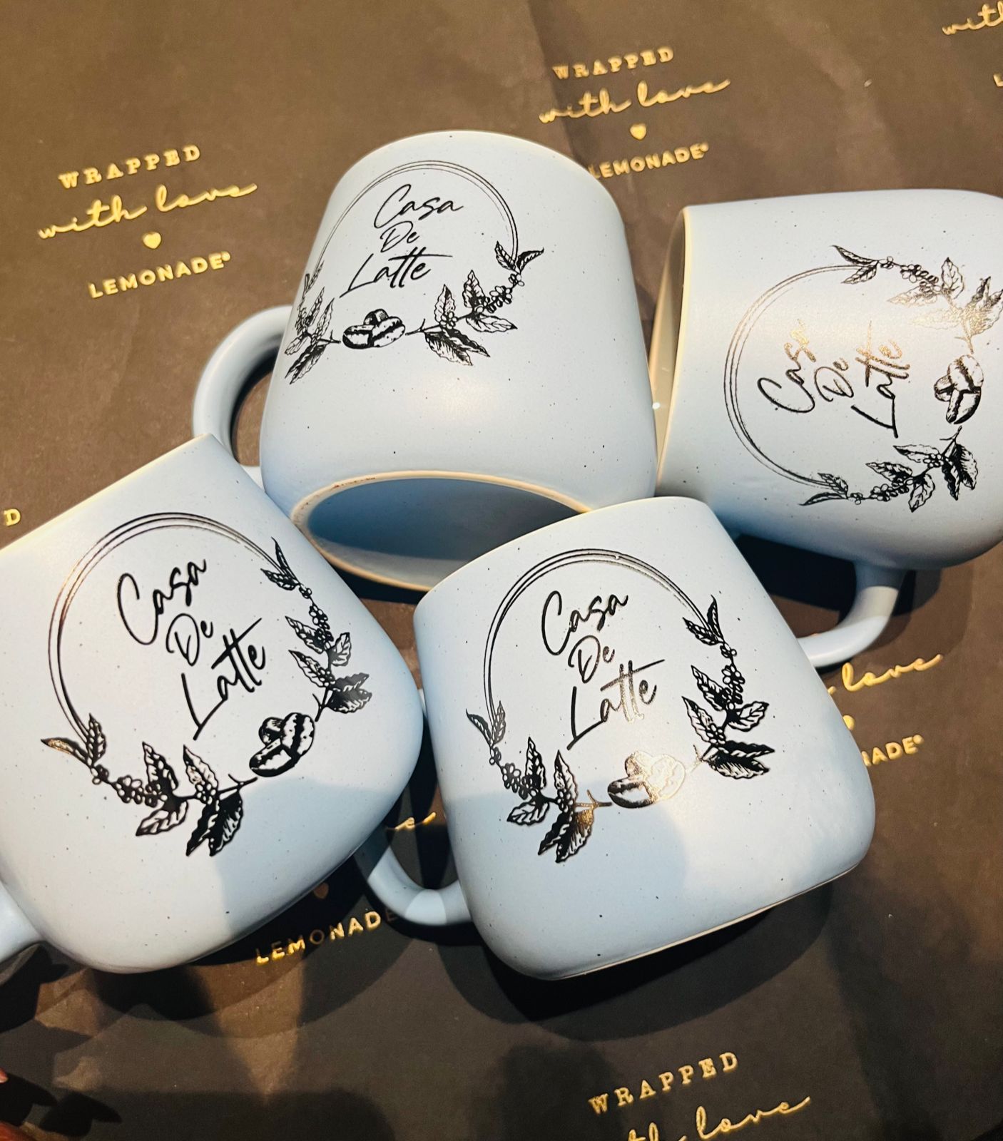 Top down view of custom initial mug with logo