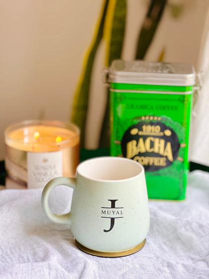 Sage Green ceramic mug on desk