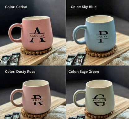 Four mugs in different colors with visible customization 