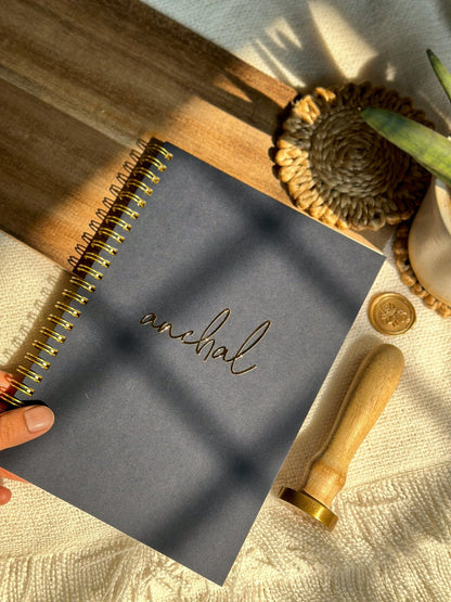 Personalized spiral notebook with gold foiled cursive text