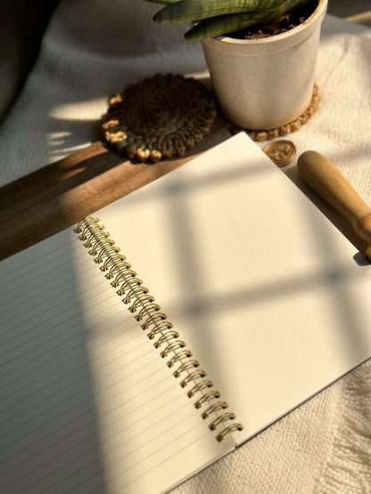 Spiral notebook with half ruled and half blank pages, ideal for writers and artists