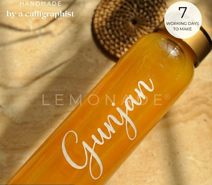 Close up of premium high-quality custom engraving on glass bottle