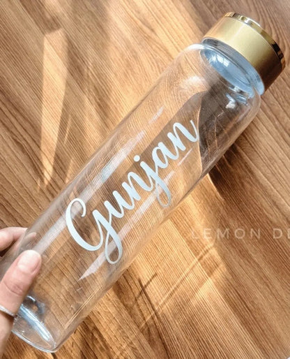 Minimalist aesthetic flatlay featuring the custom glass water bottle