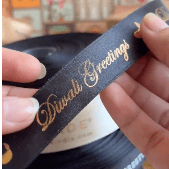 Pre-designed festive ribbon with printed designs for gift wrapping and decorations. Gold Foiled Satin Ribbon - LemonadeStationery