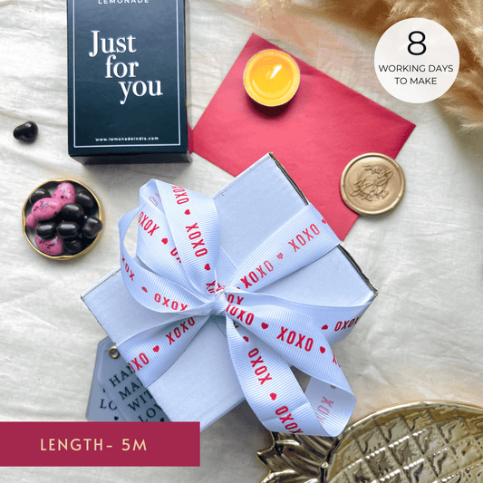 Pre-designed ribbon with printed designs for gift wrapping and decorations.- Grosgrain Ribbon 25mm - White - XOXO - LemonadeStationery