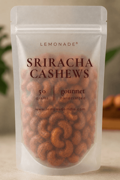 Gourmet Sriracha cashews in premium packaging, featuring roasted whole cashews coated with a bold, spicy sriracha seasoning for a crunchy snack.